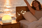 Sunrise alarm clock glowing on a bedside table