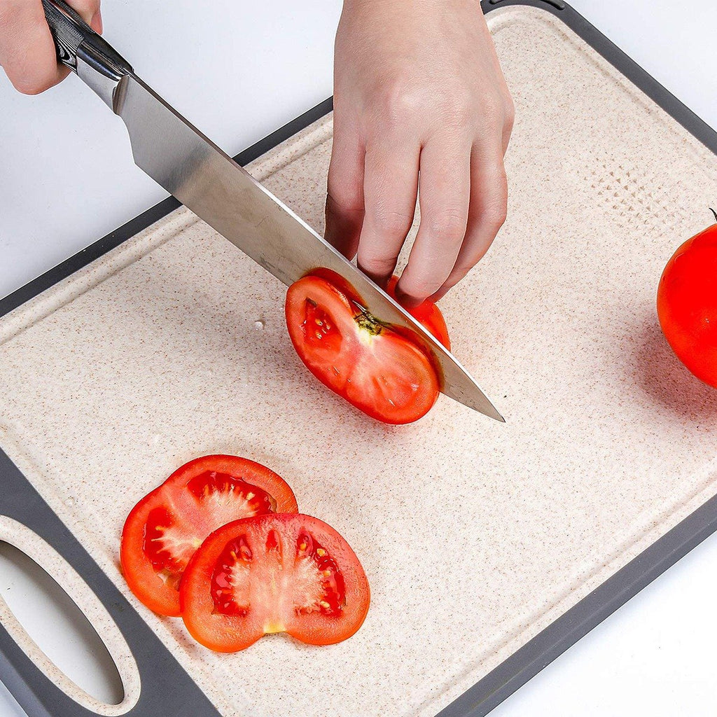 Slicing tomatoes on the cutting board