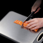 Slicing tomatoes on the cutting board